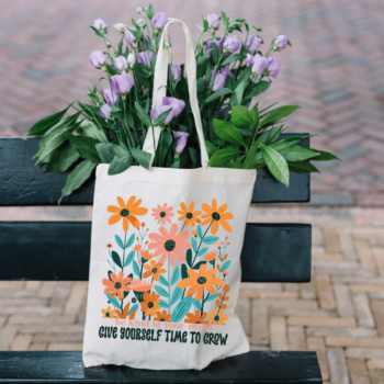 A boho-inspired Be Kind to Your Mind Give Yourself Time to Grow Boho Flower Tote Bag with delicate floral patterns on sturdy canvas fabric.