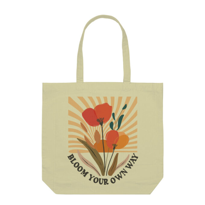 A stylish Bloom Your Own Way Boho Flower Tote Bag with vibrant floral designs on durable canvas fabric.