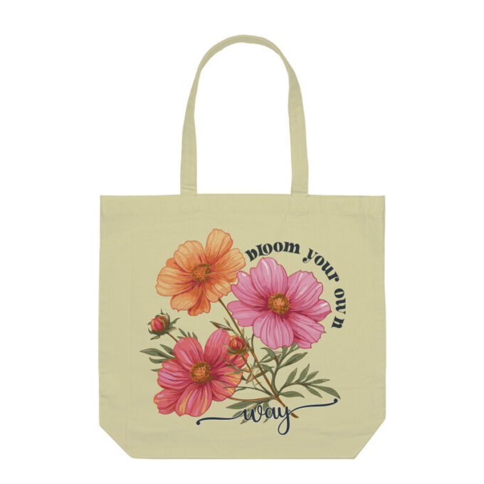 A stylish Bloom Your Own Way Boho Flower Tote Bag with vibrant floral designs on durable canvas fabric.