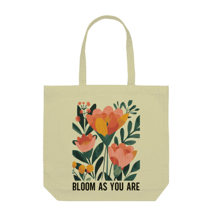 A vibrant Bloom As You Are Boho Flower Tote Bag with floral patterns on sturdy canvas fabric.