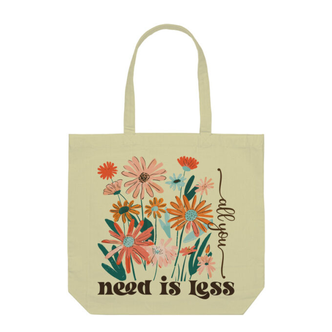 A chic All You Need Is Less Boho Flower Tote Bag with a floral design on durable canvas fabric.