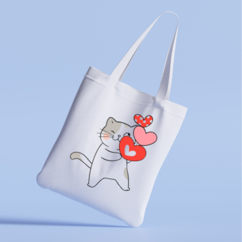 Tote bag with a playful cat and floating hearts.