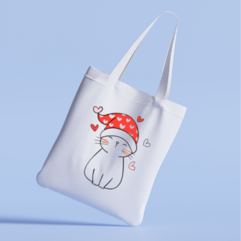 Tote bag featuring a cute cat in a holiday hat.